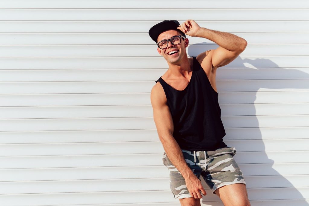 A happy man in black singlet