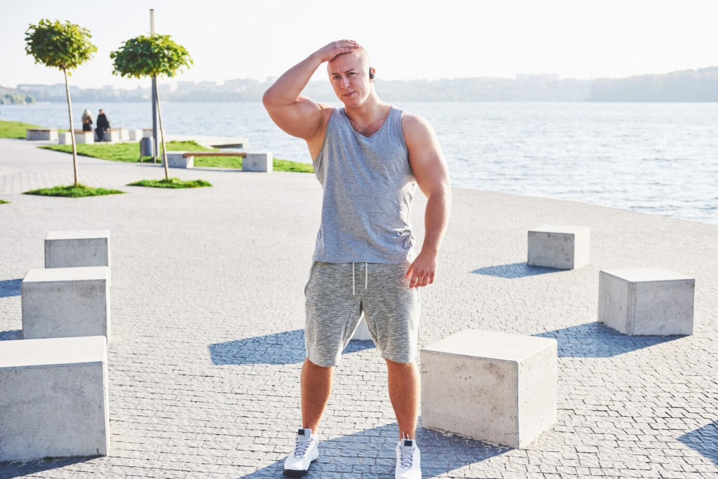 Man standing in Silky Fabrics after a workout in summer. - Summer Activewear Outfits